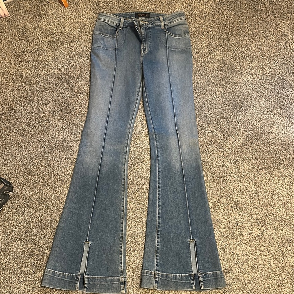 Woman’s Blue Jeans by [Brand]